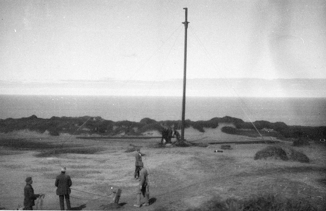 Erecting the bottom section of a mast on Wireless Hill