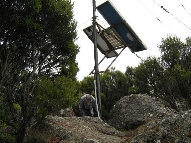 Mt Duncan installing solar panels by VK7BYL